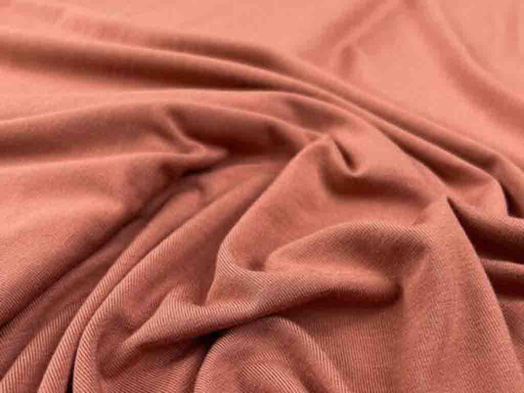 Soft brown bamboo fabric with a smooth, eco-friendly texture, commonly used for sustainable plush toy production.