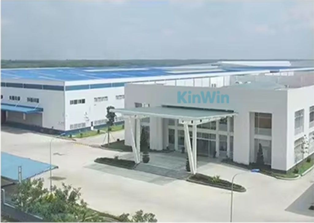 Modern KinWin plush toy manufacturing facility with white exterior and blue roof.