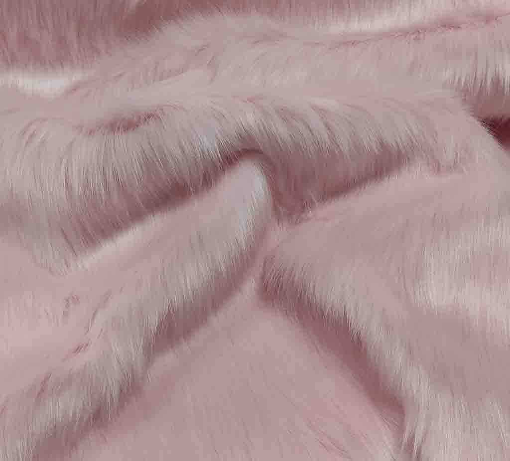 Soft pink faux fur fabric texture for plush toy making.