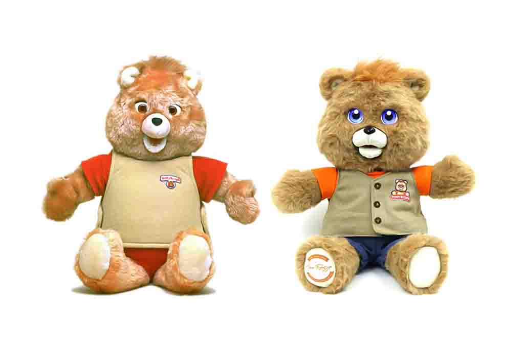 Two Teddy Ruxpin animatronic plush bears dressed in shirts and vests.
