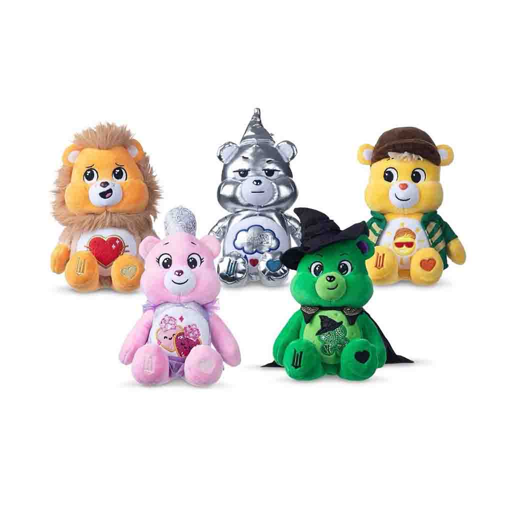 Colorful Care Bears plush toys including lion, metallic silver, pink, green witch, and yellow bear characters.