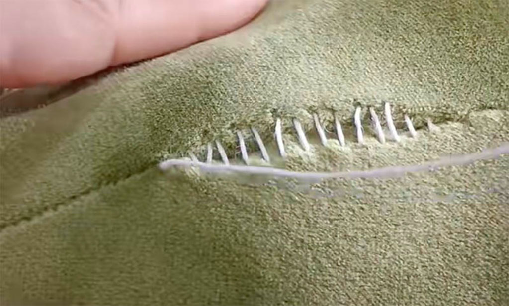 Close-up of a hidden stitch sewing method used in plush toy manufacturing to securely close seams after stuffing.