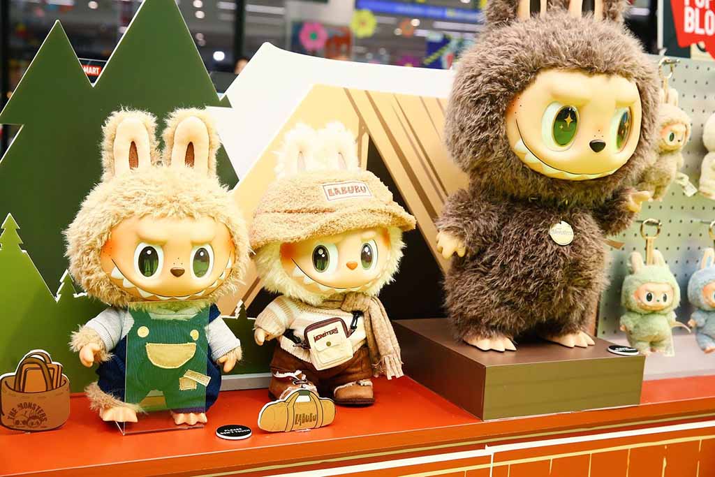 Cute LABUBU plush figures dressed in costumes with big expressive eyes and furry bunny-like outfits showcased in a toy store display.