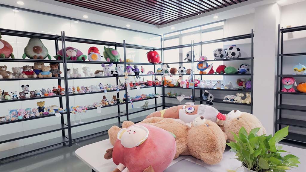 Shelves filled with various plush toys and stuffed animals in a bright showroom display.