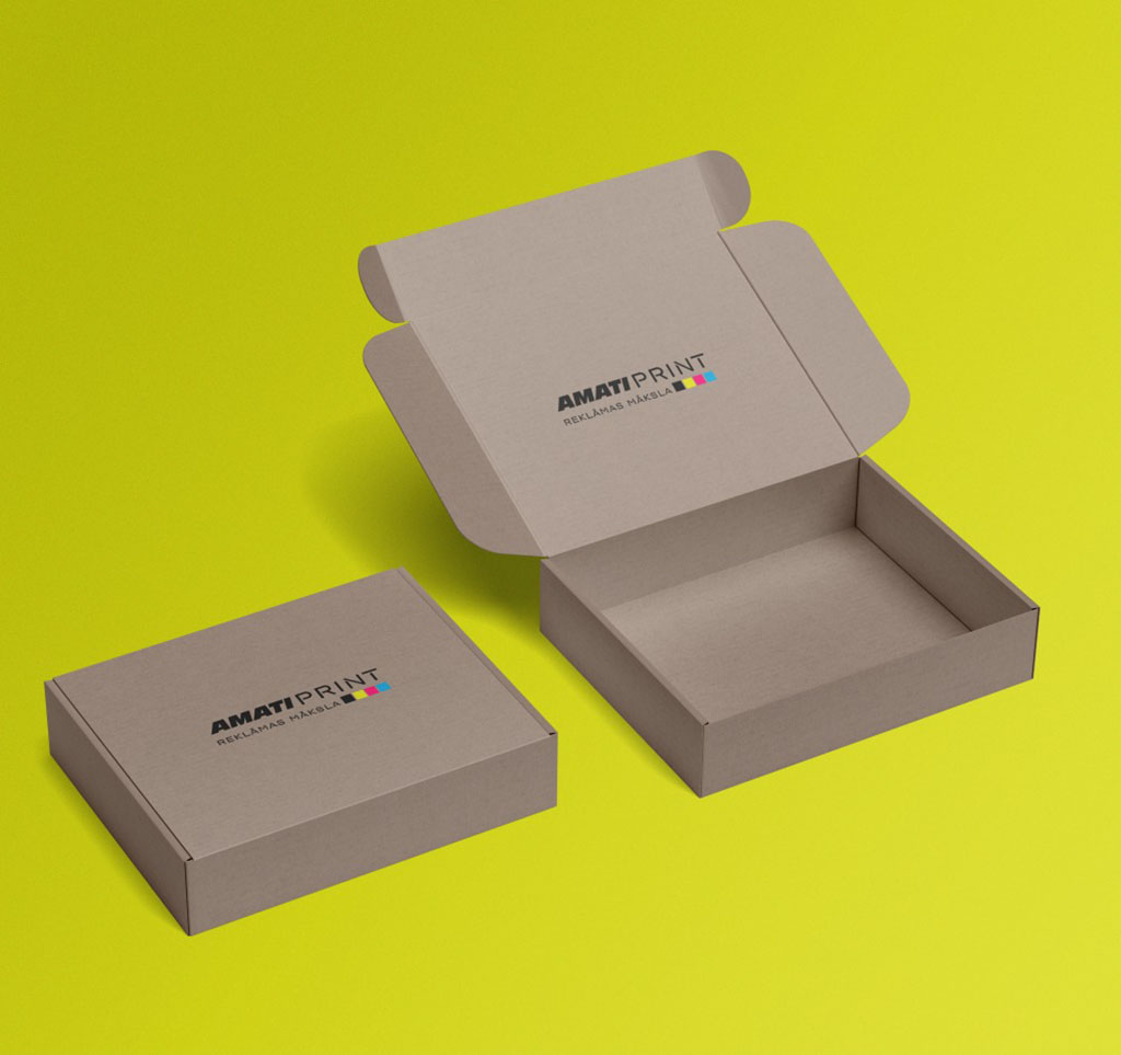 Two brown cardboard packaging boxes with printed AMATI PRINT logo, one closed and one open, displayed on a bright yellow background.