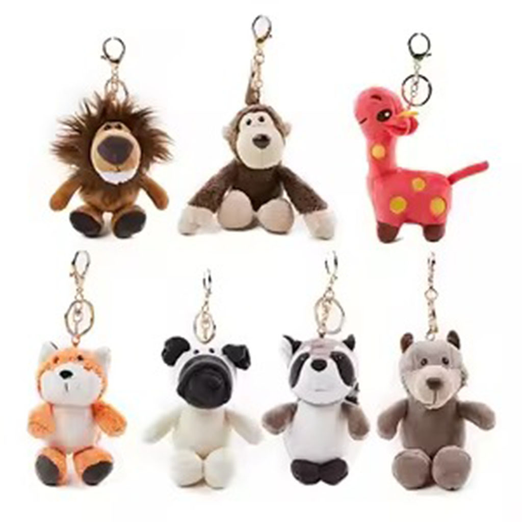 Set of cute plush animal keychains featuring lion, monkey, giraffe, fox, pug, raccoon, and bear designs on a white background.