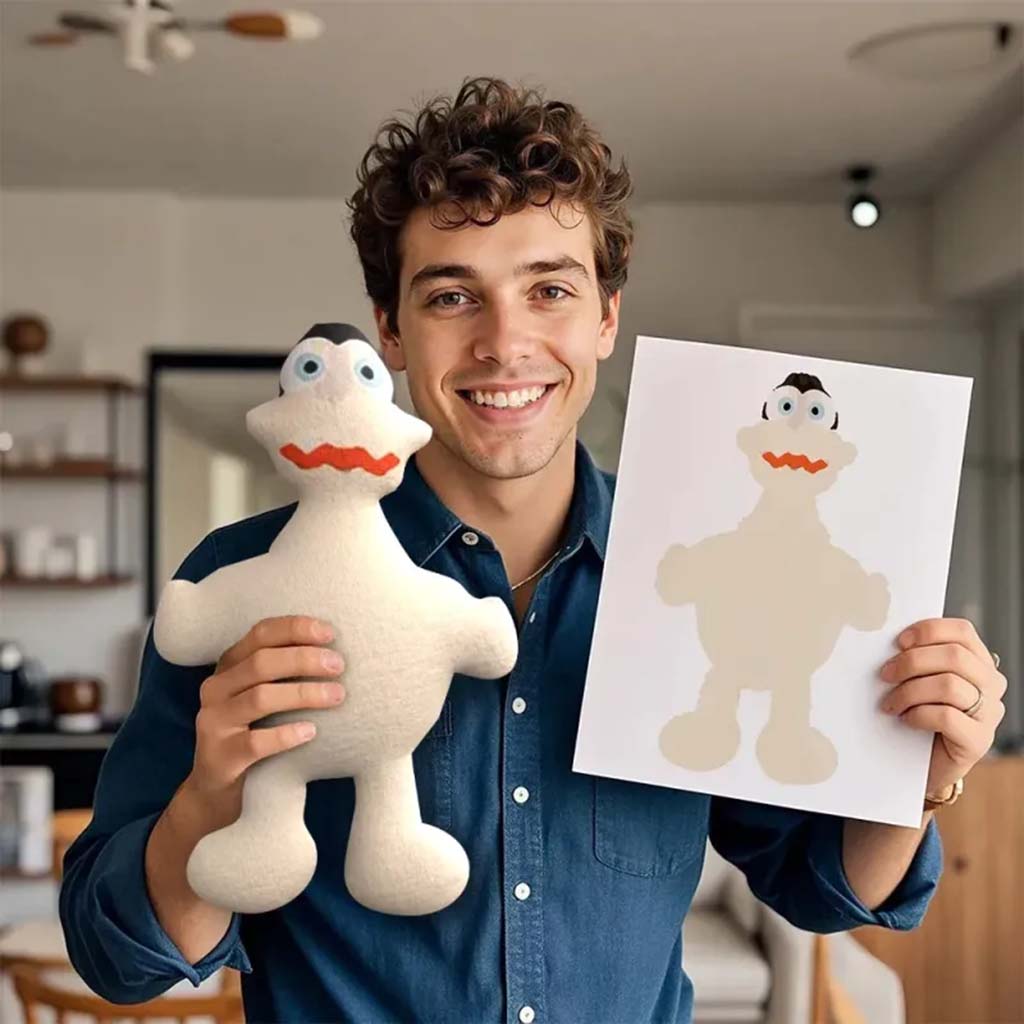 Smiling man holding a handmade plush toy and the original drawing it was based on, showing a personalized design transformed from sketch to stuffed toy.