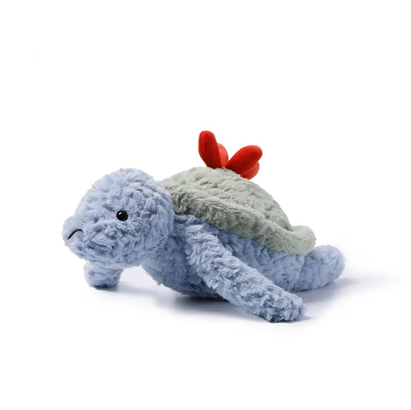 Soft blue sea turtle plush toy with a green shell and two small red hearts on its back, lying on a white background.