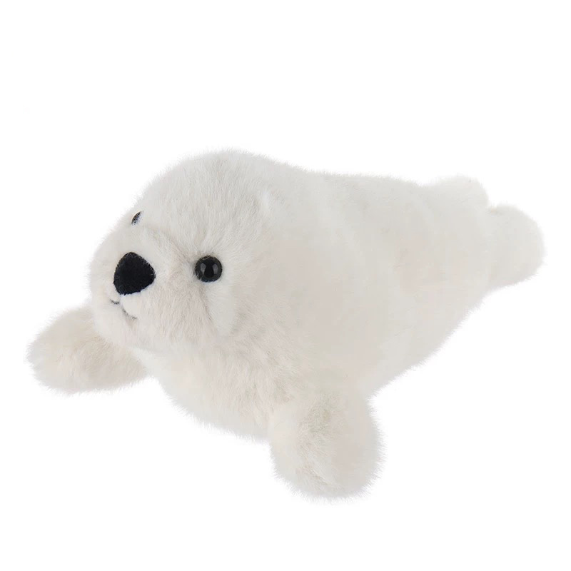 Soft white seal plush toy with black button eyes and a small black nose, lying flat on a plain white background.
