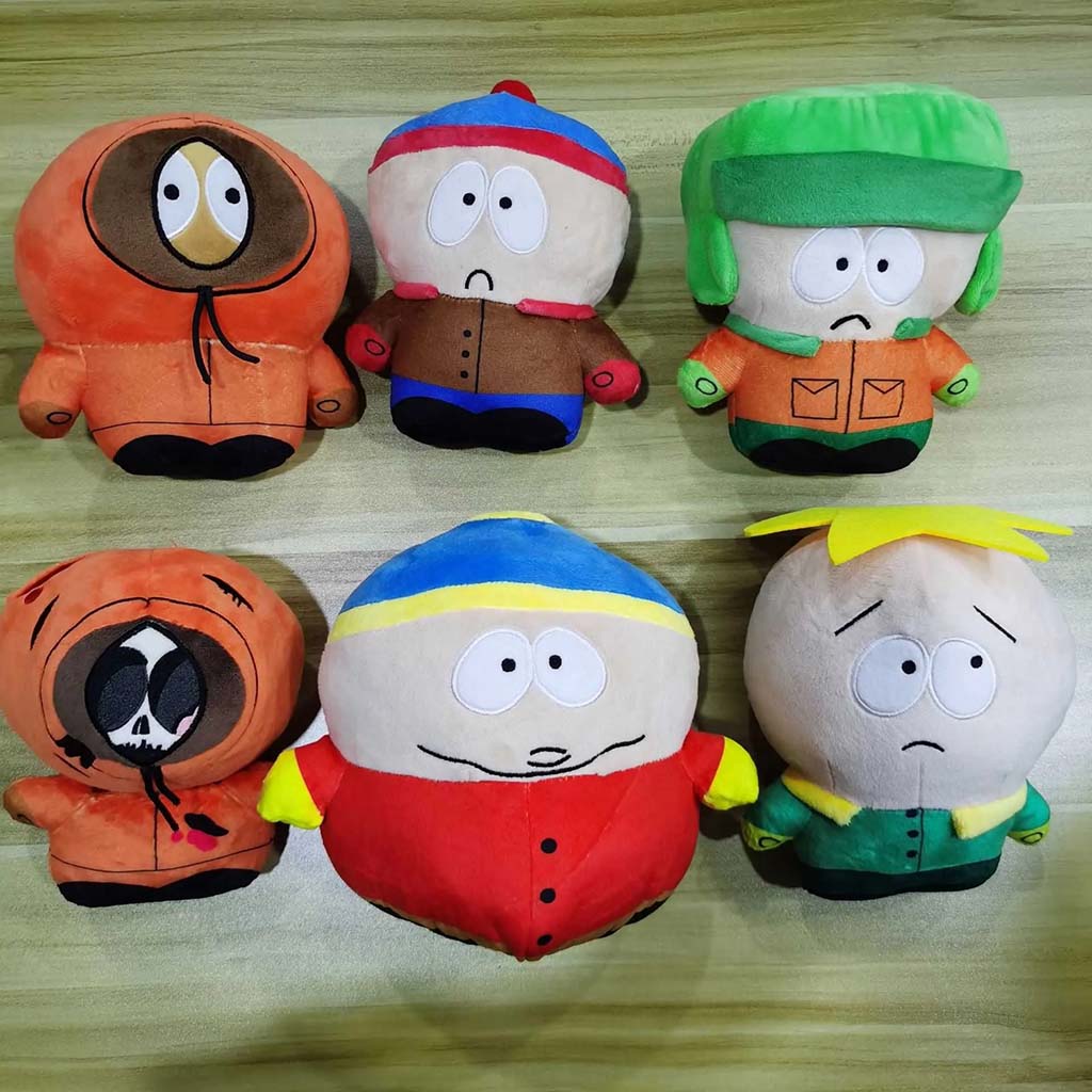 Set of six colorful cartoon plush dolls with expressive faces and winter outfits, displayed on a wooden surface.