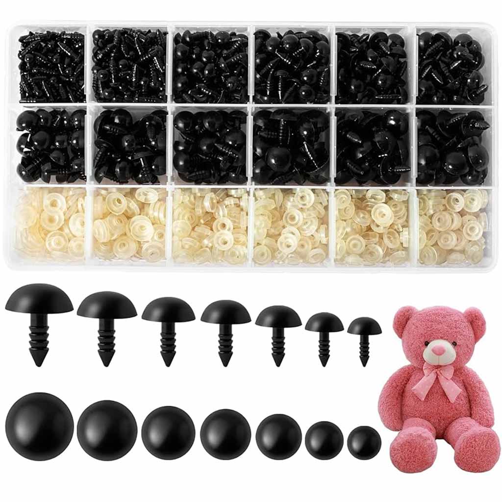 Assorted black plastic safety eyes with washers and sizes displayed beside a pink teddy bear.