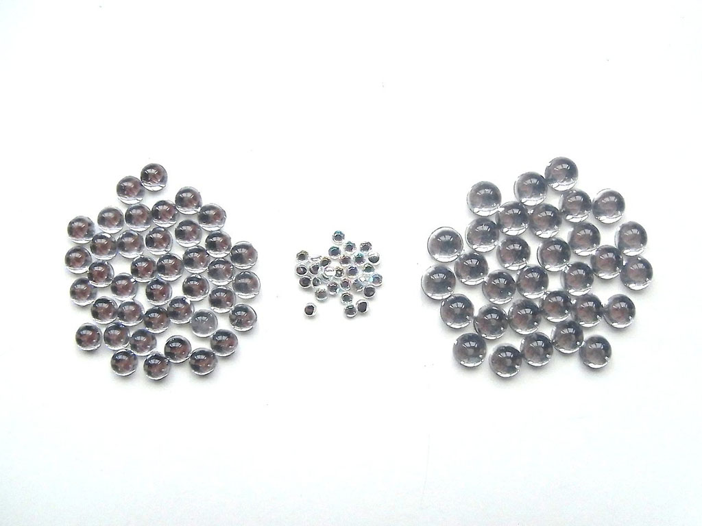Assorted sizes of round black and clear plastic safety eyes for plush toys and stuffed animals displayed on a white background.