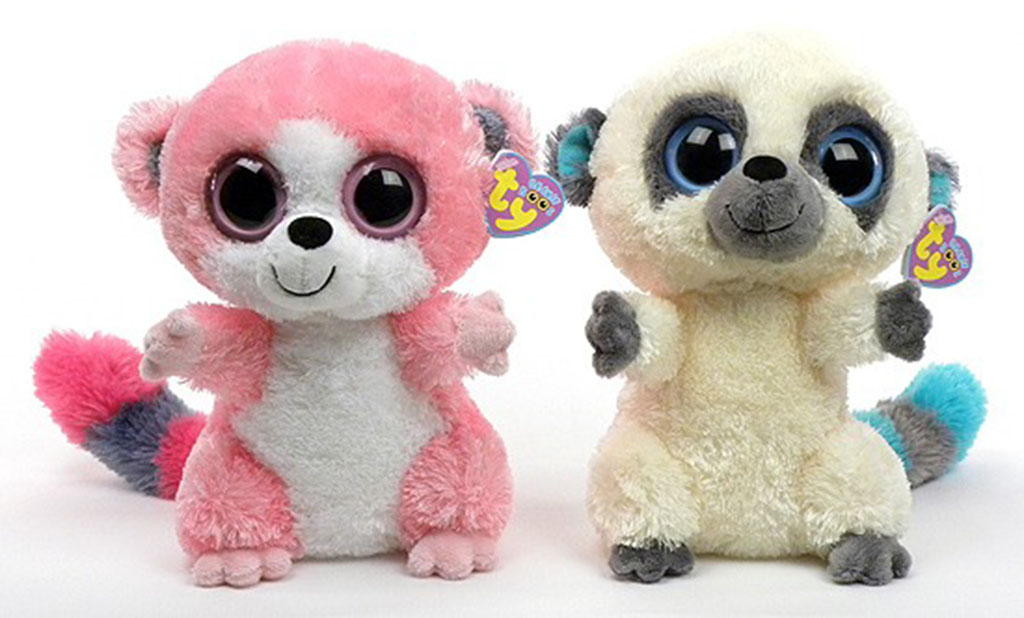 Two colorful plush lemur toys with large sparkling eyes, one pink and one cream, sitting side by side.