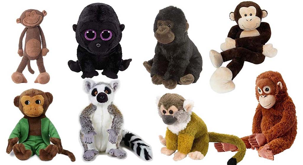 A collection of plush toy monkeys, gorillas, lemurs, and other primates in various colors and styles arranged against a white background.
