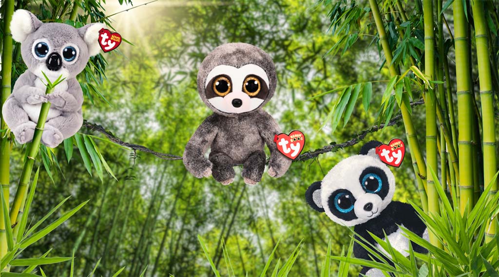 Three plush animals—a koala, sloth, and panda with large eyes and Ty tags—hanging and sitting among green bamboo trees in a jungle setting.