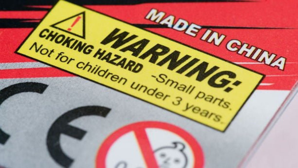 Close-up of a toy package showing CE mark and choking hazard warning label “Not for children under 3 years,” ensuring EN71 safety compliance.