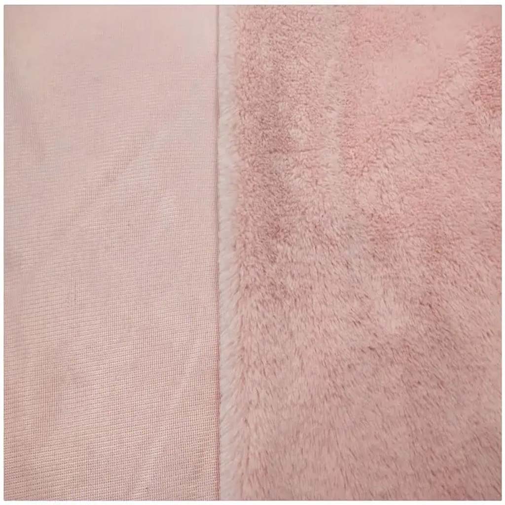 Close-up view of pink plush fabric showing soft pile texture on one side and woven backing on the other, ideal for stuffed toys and upholstery.