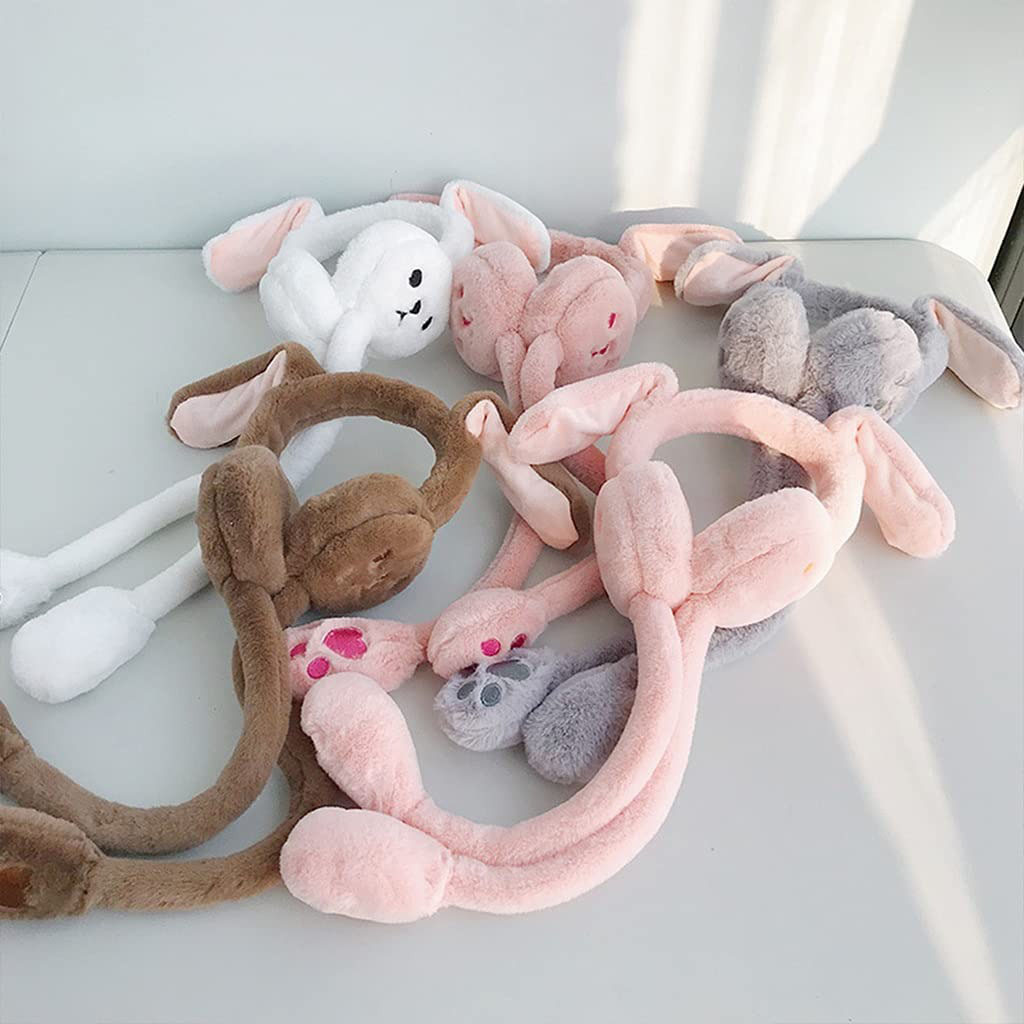 Soft plush bunny ear headbands in pastel colors including pink, white, gray, and brown, displayed on a white surface under natural light.