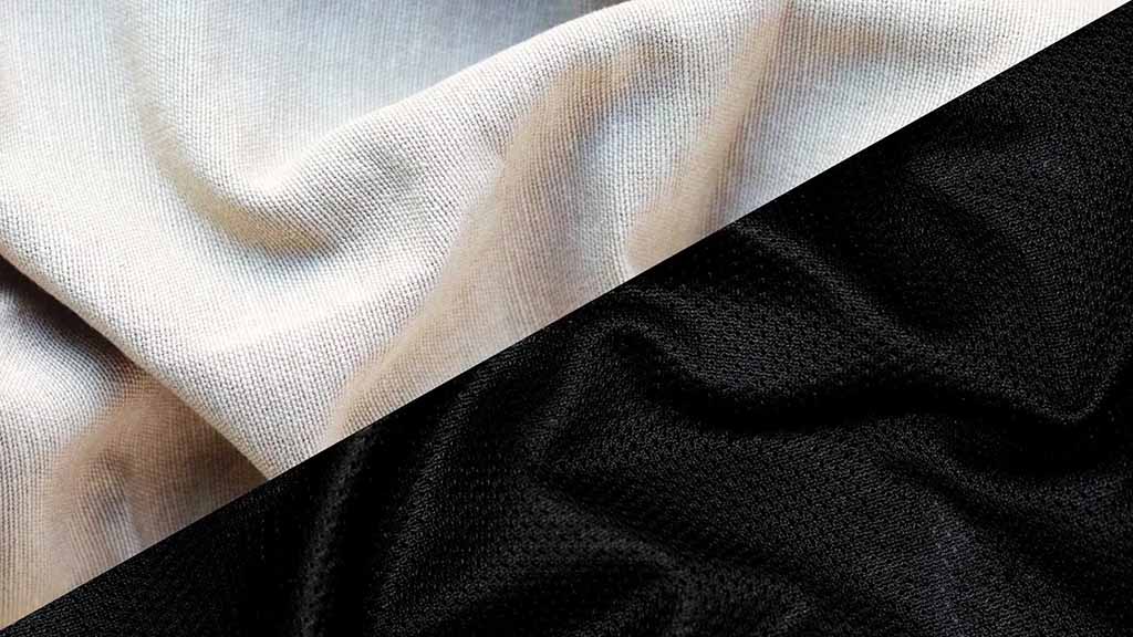 Close-up of beige and black tricot fabric surfaces showing smooth and elastic knit texture used in plush toy manufacturing.