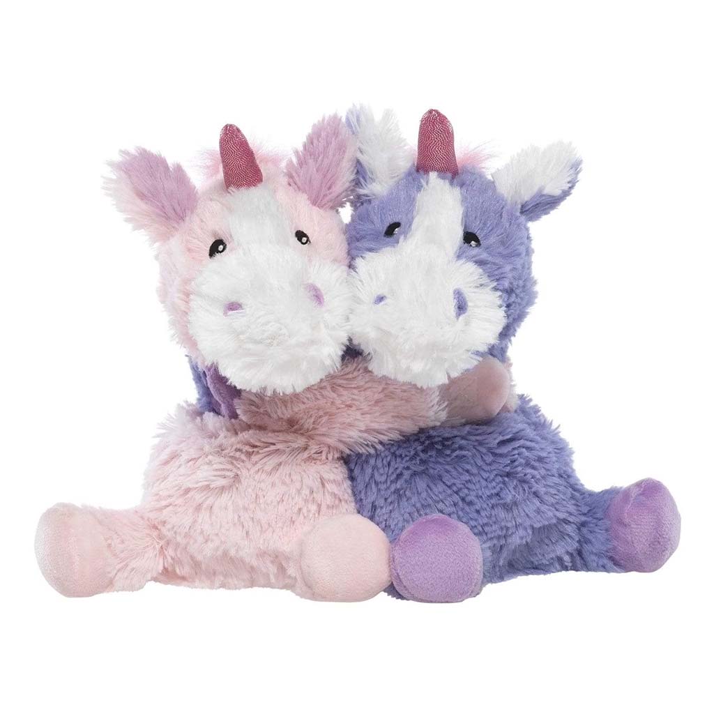 Two cuddly unicorn plush toys, one pink and one purple, sitting together and hugging each other with white muzzles and glittery pink horns on a white background.