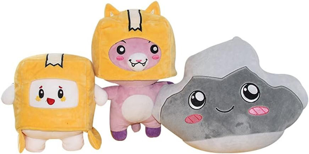 Three cute cartoon plush toys including a yellow box character, a pink animal with cat ears, and a smiling gray rock plush, all with cheerful expressions.