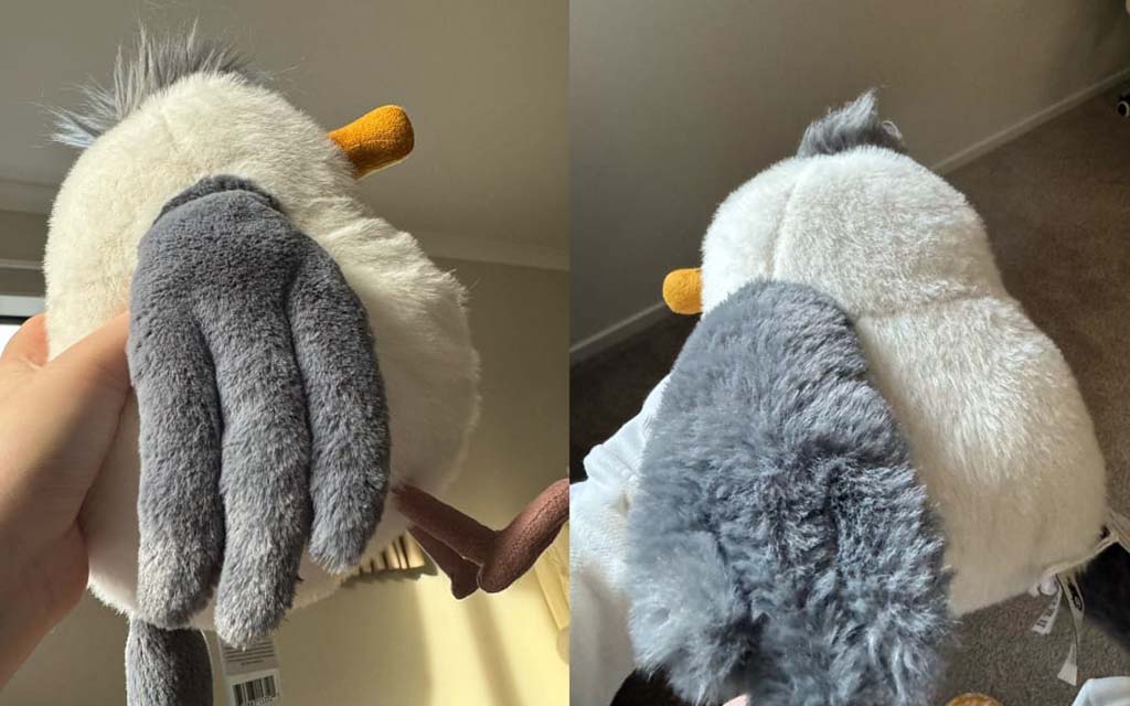 Side-by-side images of a plush seagull toy showing two different wing textures—one smooth gray and one fluffy gray—held in hand for comparison.