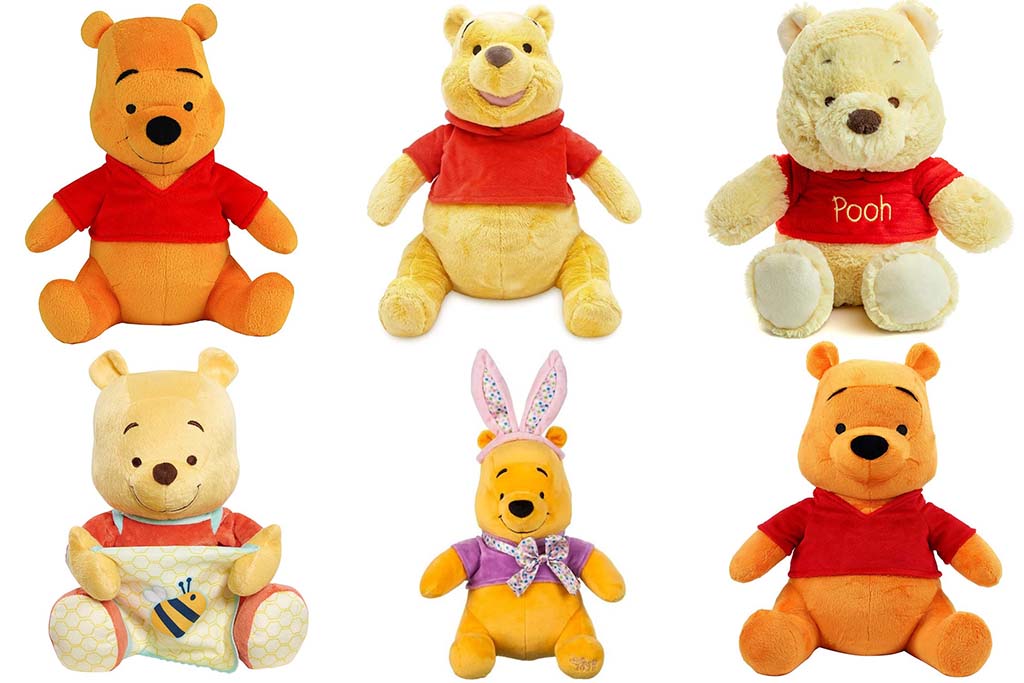 A collection of six different Winnie the Pooh plush toys, each with unique designs, colors, and outfits, arranged in two rows on a white background.