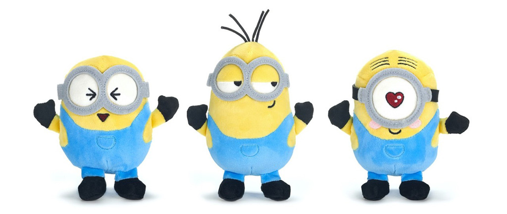 Three small yellow cartoon-style plush toys wearing blue overalls, each with a different facial expression and single or double goggles, standing side by side on a white background.