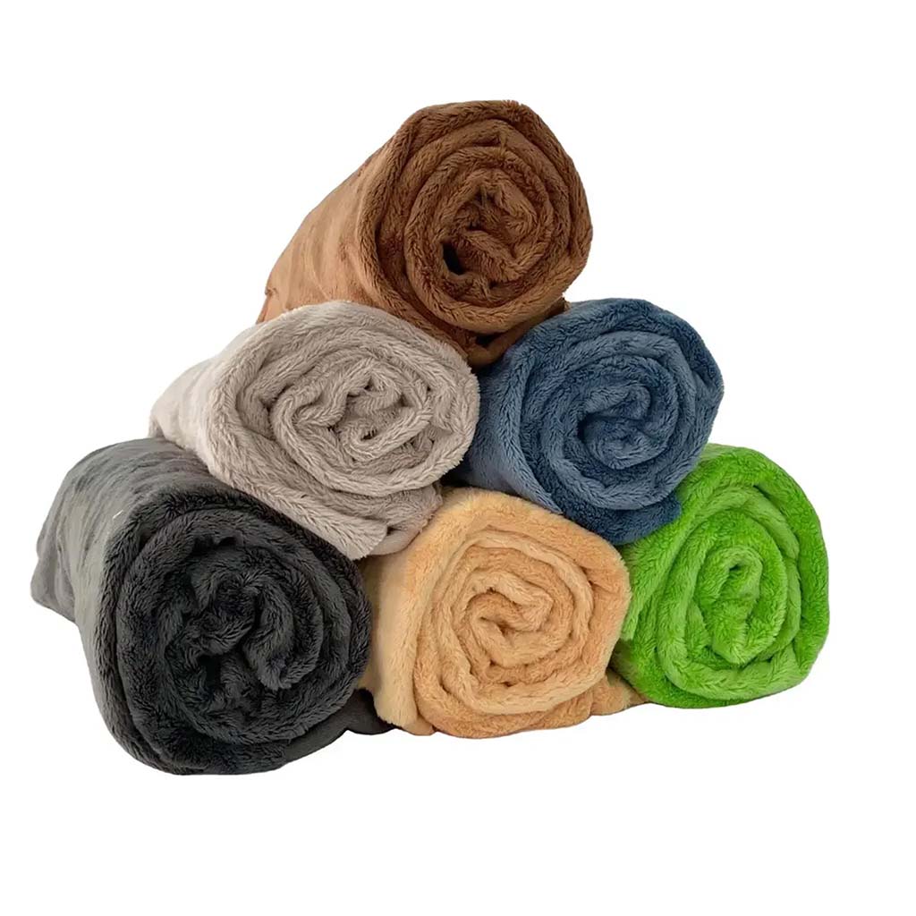 A stack of rolled plush minky fabrics in various colors including brown, gray, beige, blue, green, and tan.