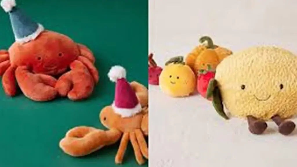 Cute plush crab, lobster, and fruit toys wearing festive hats displayed on green and white backgrounds.