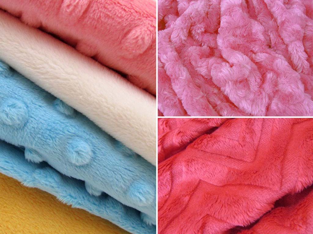 Close-up collage of soft plush fabrics in pastel pink, blue, and cream tones showing various textures like minky dots, shaggy pile, and chevron patterns used for stuffed animals.