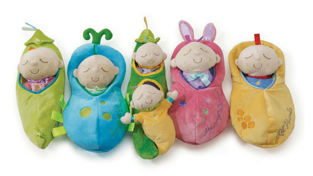 Set of cute baby-themed plush dolls in colorful sleeping bags shaped like fruits and vegetables with embroidered details.