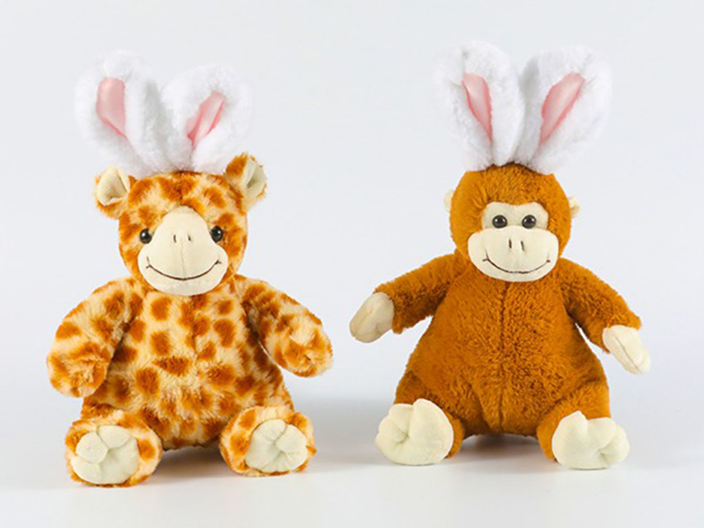 Two plush toys, a giraffe and a monkey, both wearing white and pink bunny ears, sitting side by side on a white background.