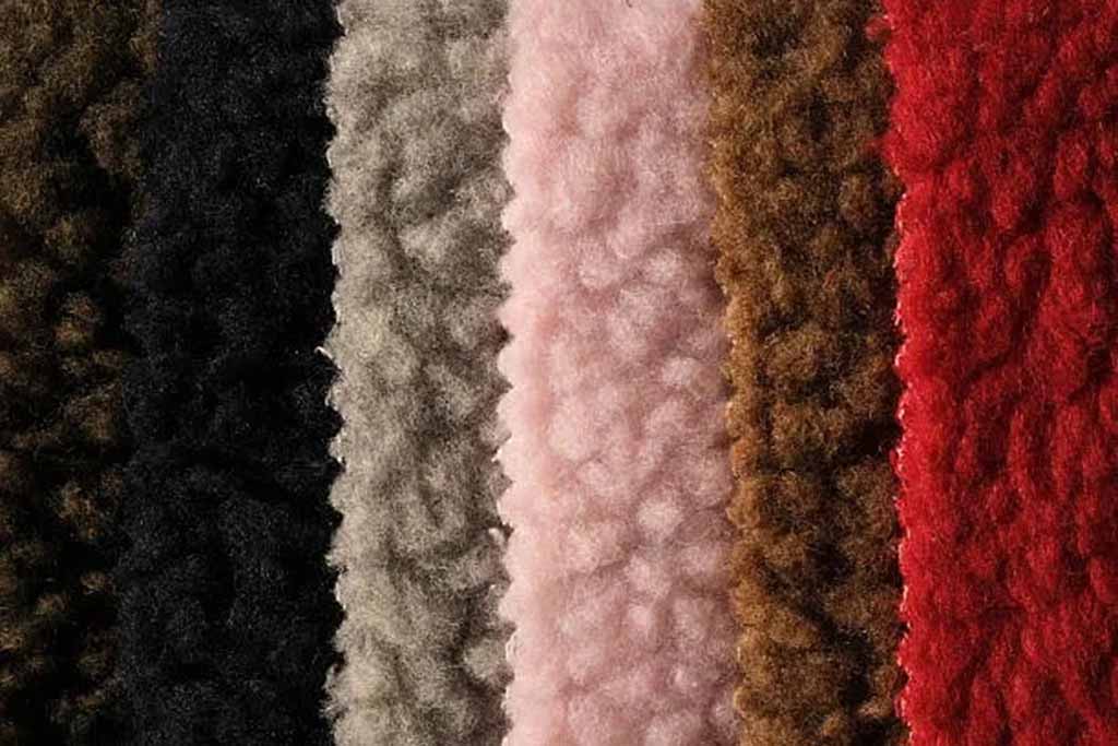 Close-up of multiple teddy velvet fabric colors.