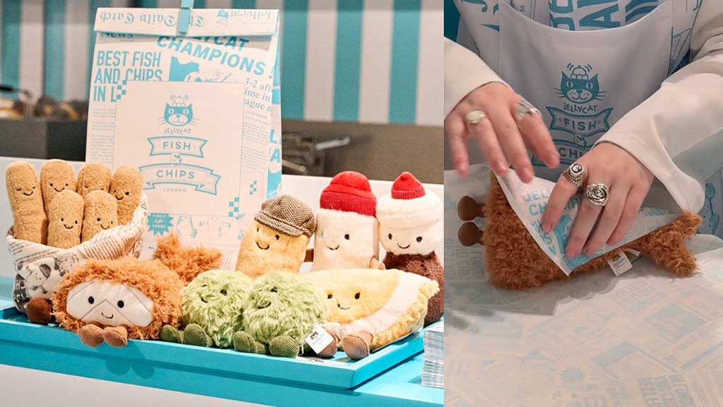 Display of Jellycat plush toys themed as fish and chips—including smiling fries, mushy peas, fish fillet, and condiments—alongside a person packaging one of the plush items.