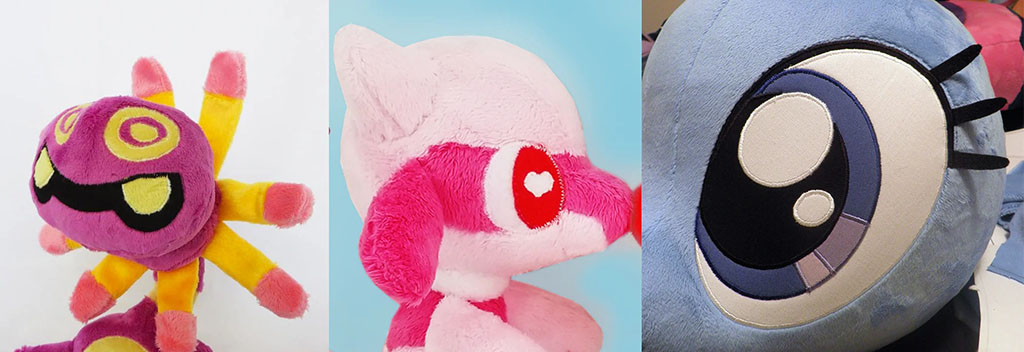 Close-up view of three custom plush toys showing detailed applique embroidery work, featuring vibrant colors, expressive eyes, and high-quality stitching techniques used in plush manufacturing.