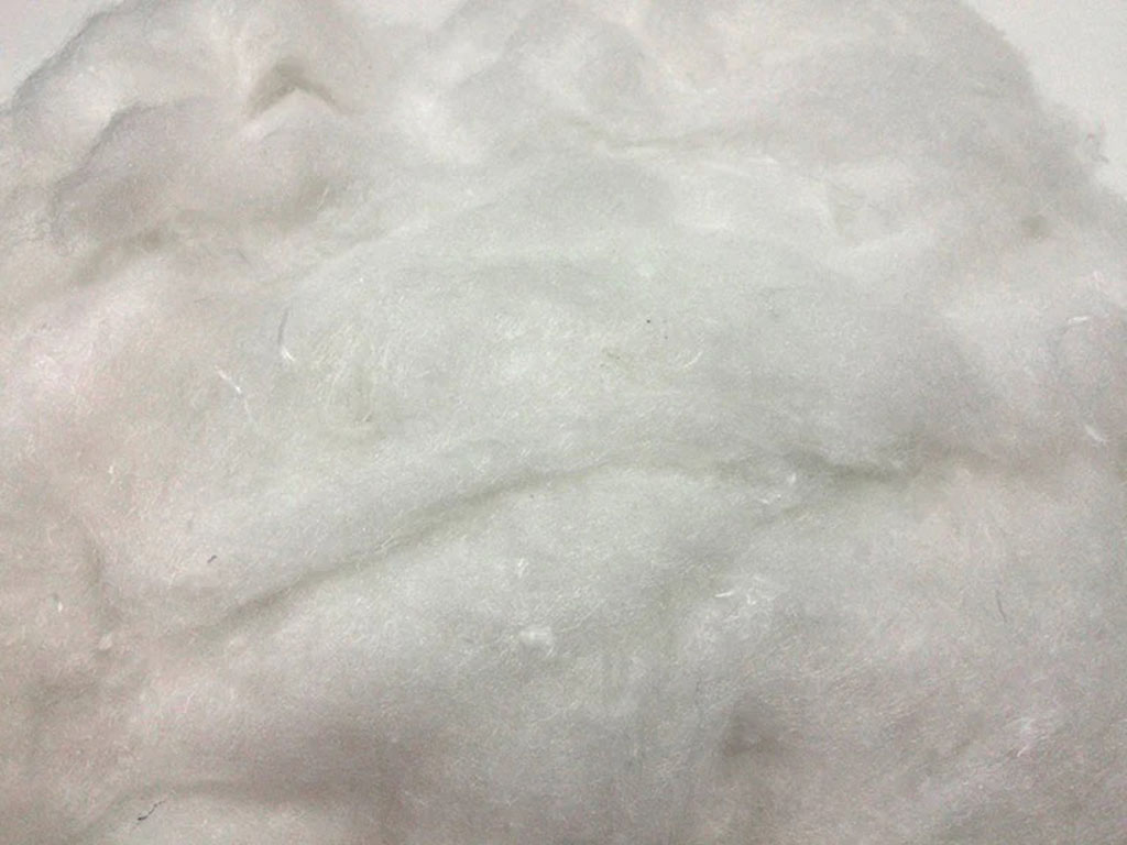 Close-up of soft white polyester fiberfill used as inner stuffing for plush toys and cushions
