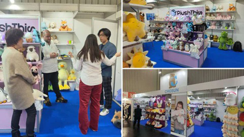 Multiple booths at a toy fair displaying plush toys, with visitors discussing products and shelves filled with stuffed animals from different brands.