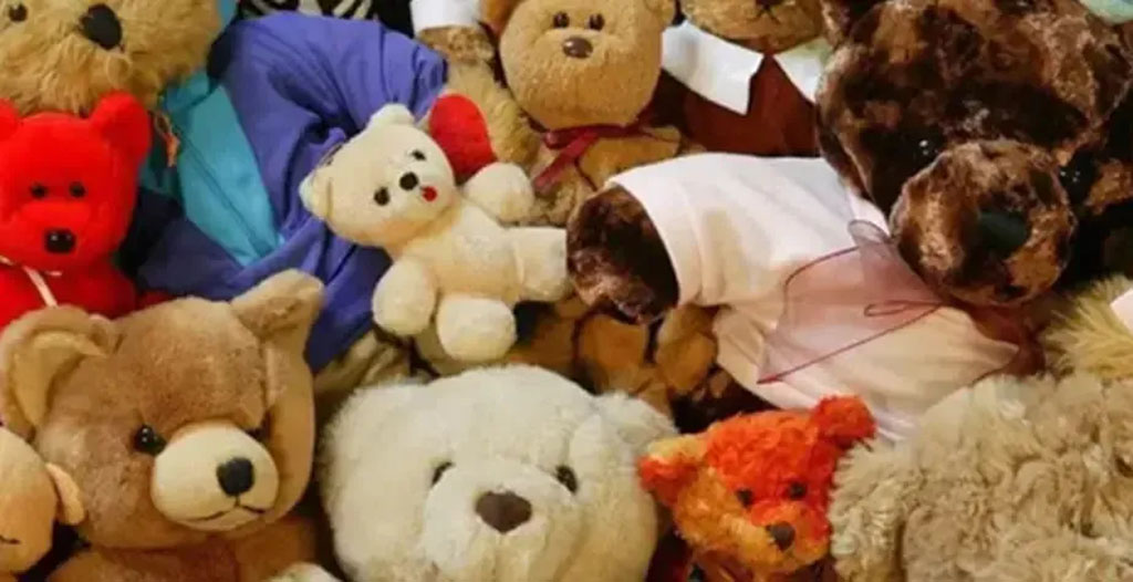 Group of assorted teddy bears made from different plush fabrics and colors, showcasing various textures and styles used in plush toy manufacturing.