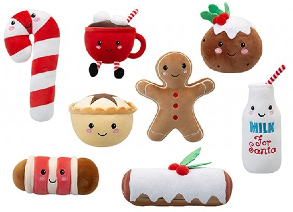 A collection of adorable Christmas-themed plush toys, including a candy cane, hot cocoa mug, Christmas pudding, mince pie, gingerbread man, milk bottle, striped pastry, and holiday cake roll, all with cute smiling faces and festive colors.
