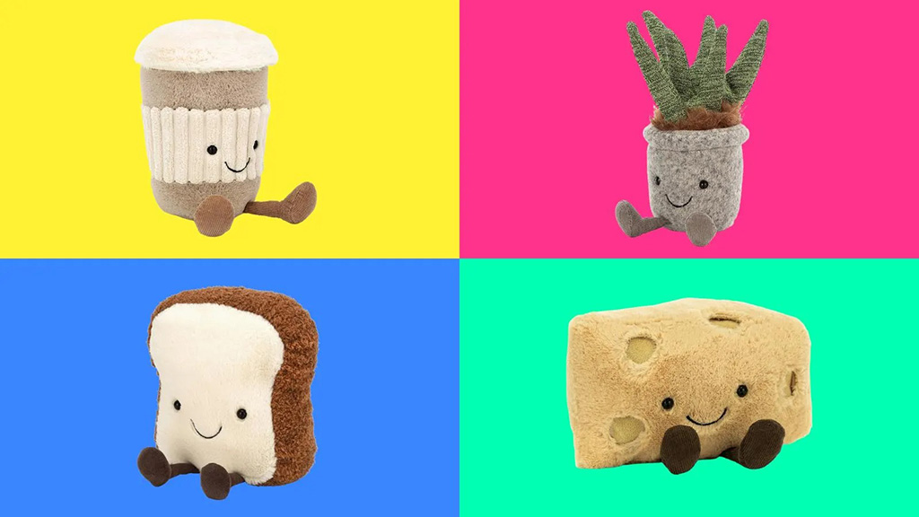 Four smiling plush items—a coffee cup, potted plant, bread slice, and cheese block—displayed on bright colorful backgrounds.