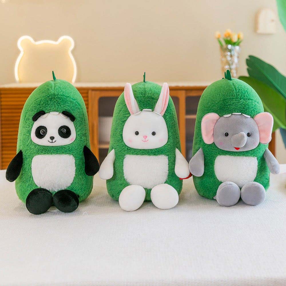 Three green plush toys shaped like cute animals—a panda, a rabbit, and an elephant—sitting side by side on a table in a cozy indoor setting, showcasing soft fabric texture and playful character design.