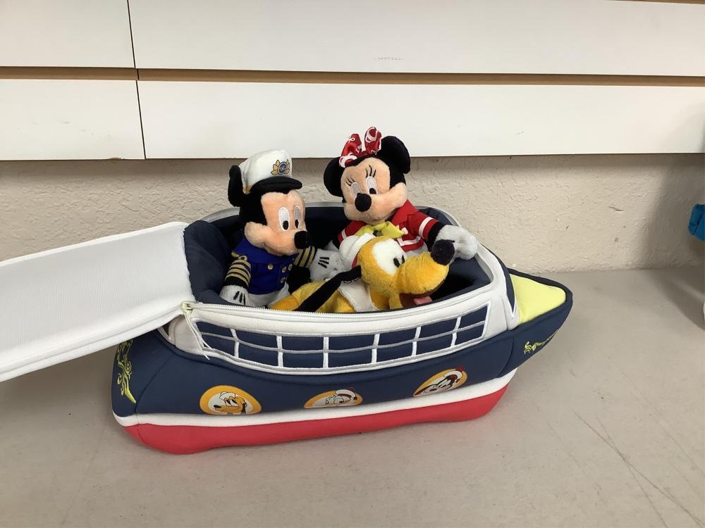 Plush Mickey, Minnie, and Pluto toys seated inside a soft cruise-ship carrier with zipper opening and embroidered nautical details.