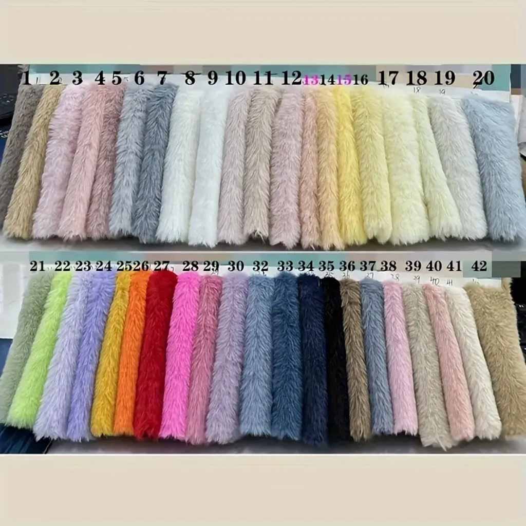 A display of numbered long-pile faux fur fabric swatches in a wide range of colors, arranged in two rows for selection.