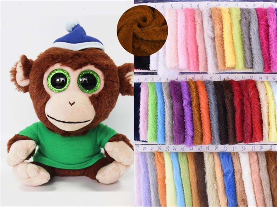 Plush monkey toy made with soft plush fabric alongside a wide color swatch chart of plush toy fabrics, showing pile texture, thickness, and color options commonly used in stuffed animal manufacturing