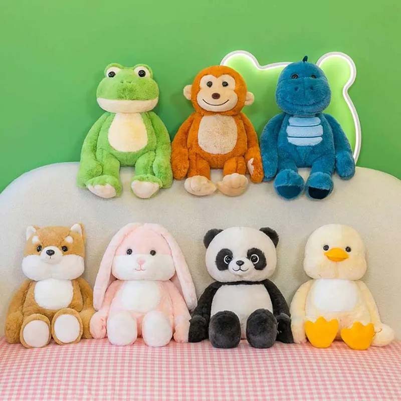A colorful set of small sitting animal plush toys, including frog, monkey, dinosaur, fox, bunny, panda, and duck designs, displayed on a sofa, showcasing soft plush fabrics, consistent size styling, and suitability for children’s gifts, retail plush collections, and OEM plush toy manufacturing.