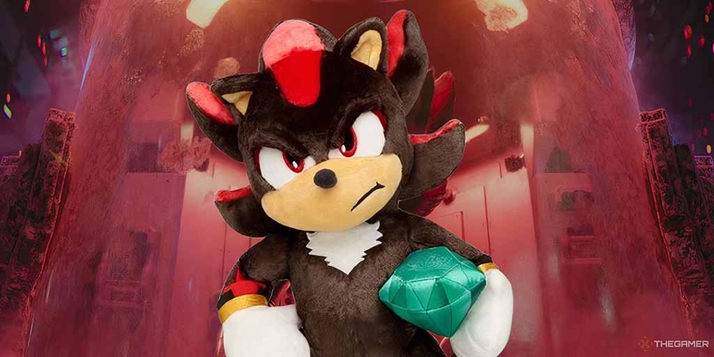 Licensed hedgehog character plush toy holding a green gem accessory, featuring bold facial embroidery, accurate color blocking, sculpted details, and premium soft plush fabric, demonstrating high-complexity licensed character plush manufacturing, OEM accuracy control, and branded entertainment merchandise production.