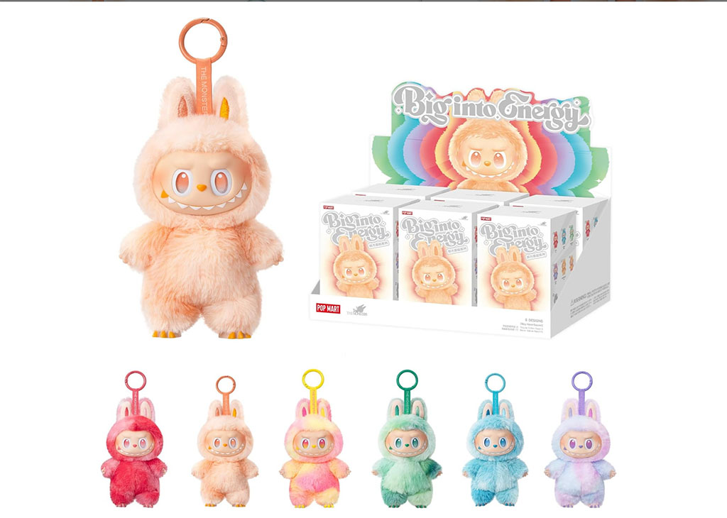 Big-eyed bunny-costume plush keychain characters displayed in multiple pastel colors, shown alongside branded blind-box retail packaging.