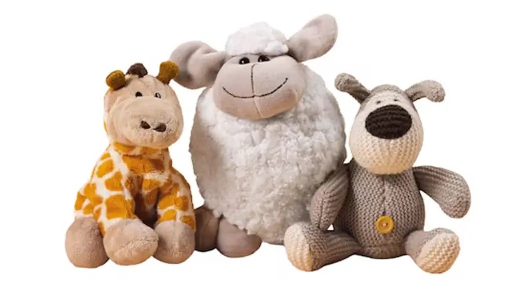 Plush giraffe, sheep, and dog stuffed toys.