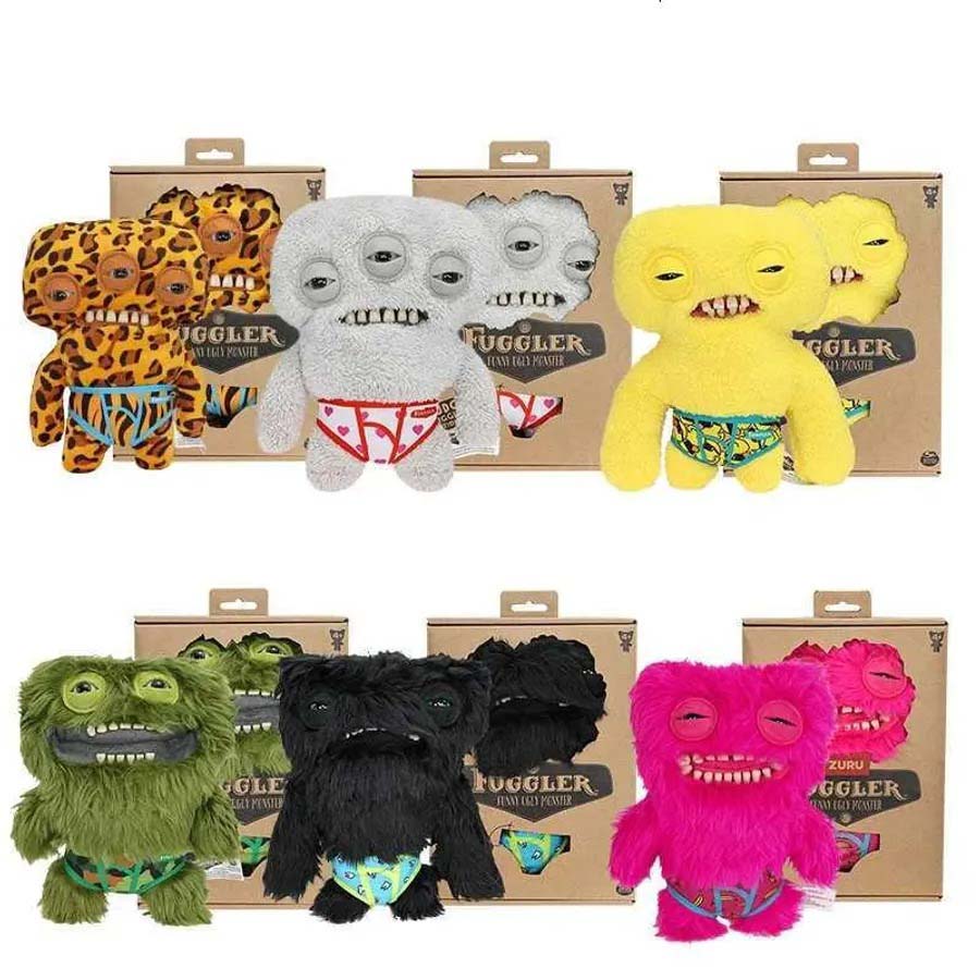 A collection of Fuggler Funny Ugly Monster plush toys in assorted colors and designs, each with quirky facial expressions, odd teeth, and patterned underwear, displayed in front of their branded packaging boxes.